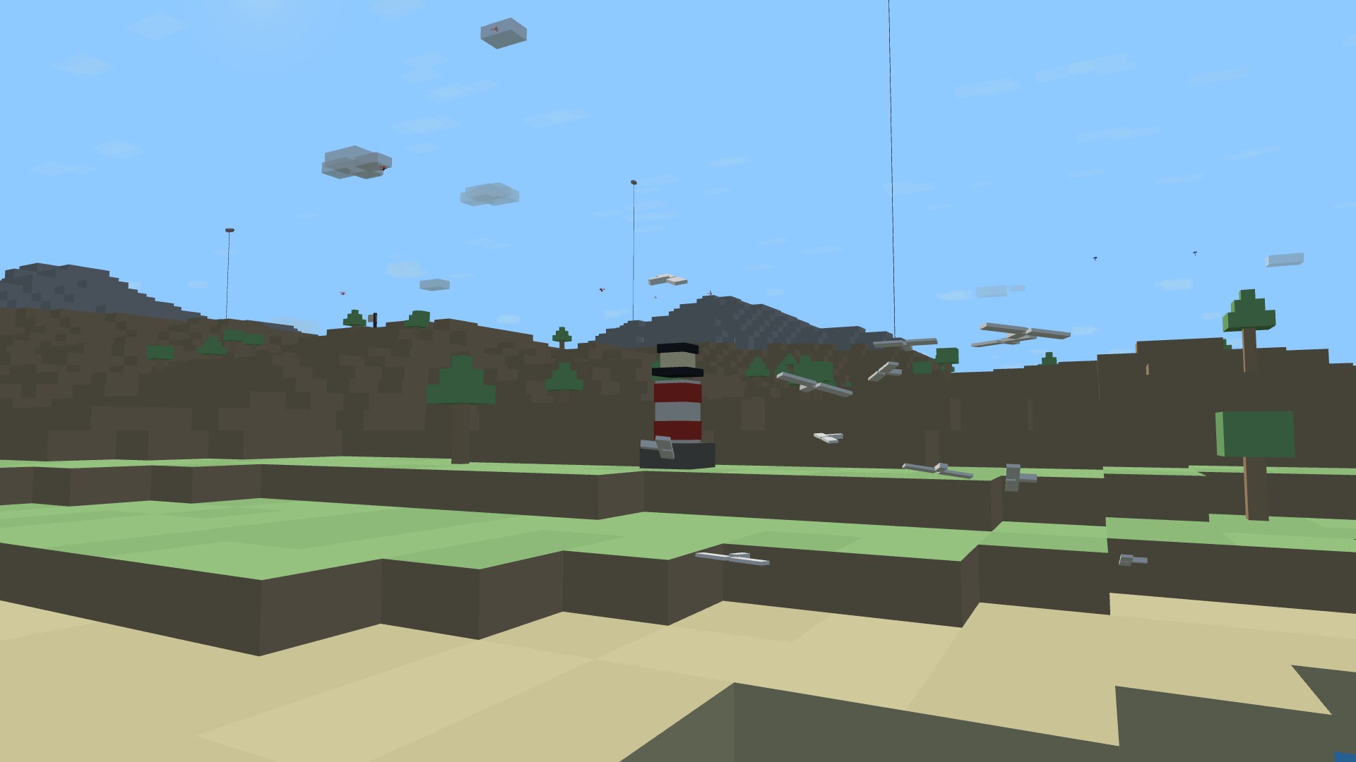 The striped coastal lighthouse by day with a flock of gulls wheeling around it over the shore