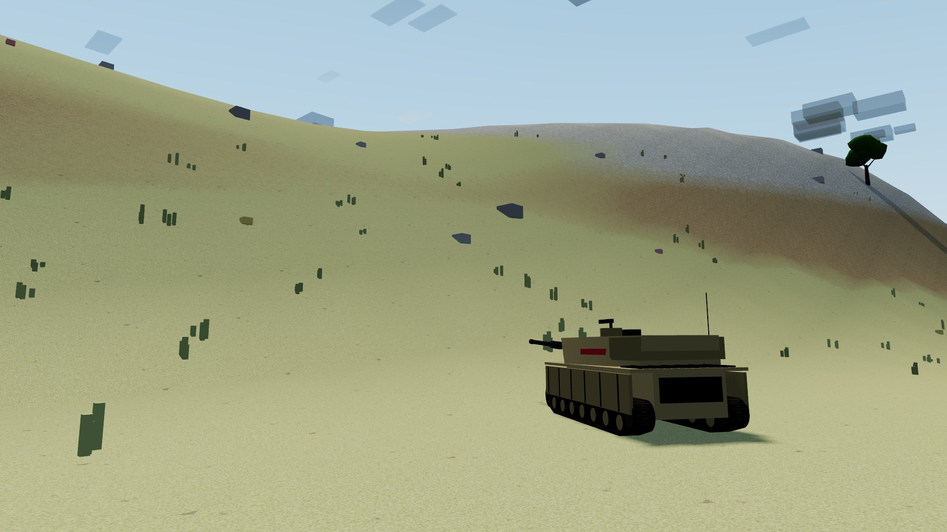 A tank climbing a smooth grassy rise on the steppe, tufts of tall grass and half-buried boulders on the slope, bare earth and stone on the crest above